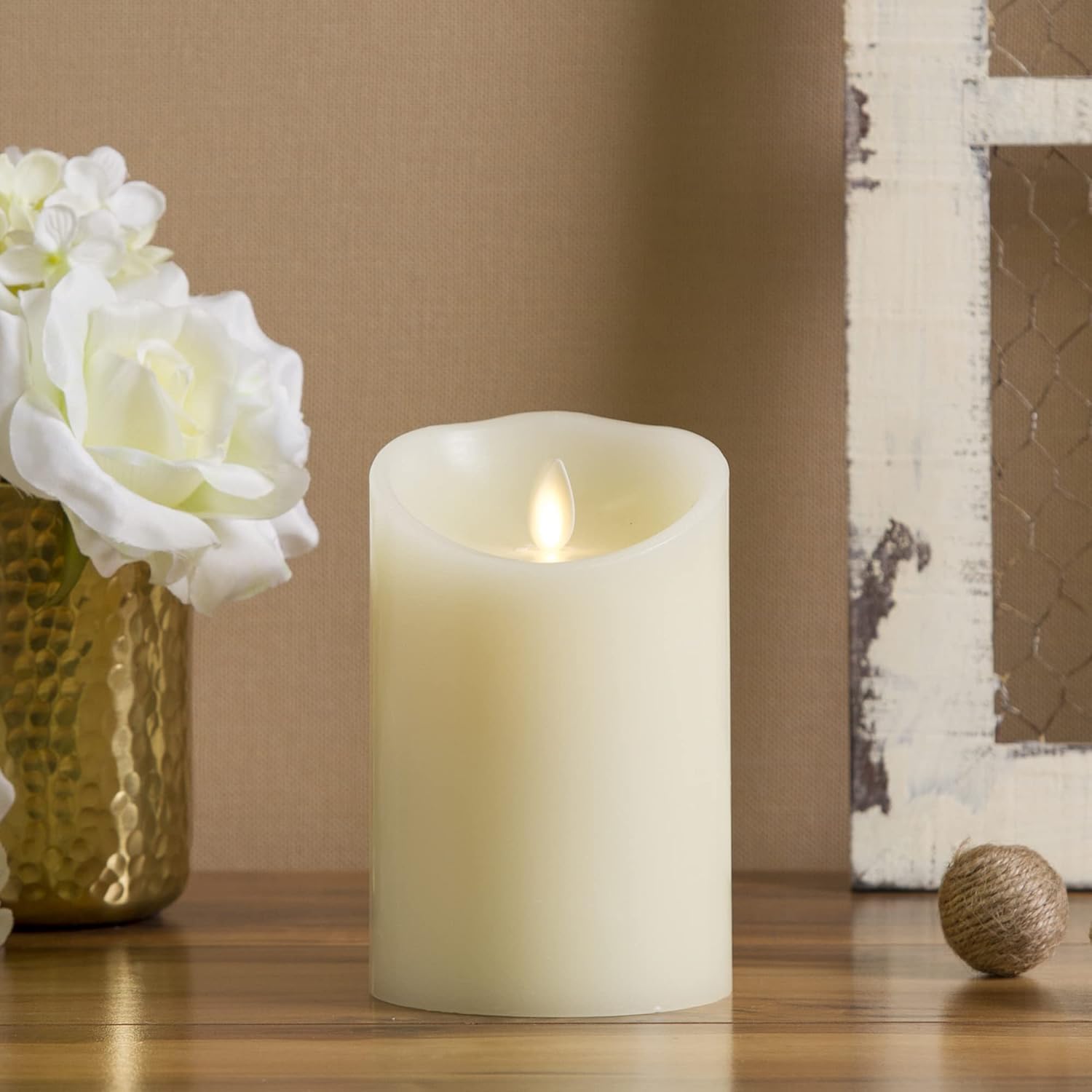 Four ivory Luminara flameless candles